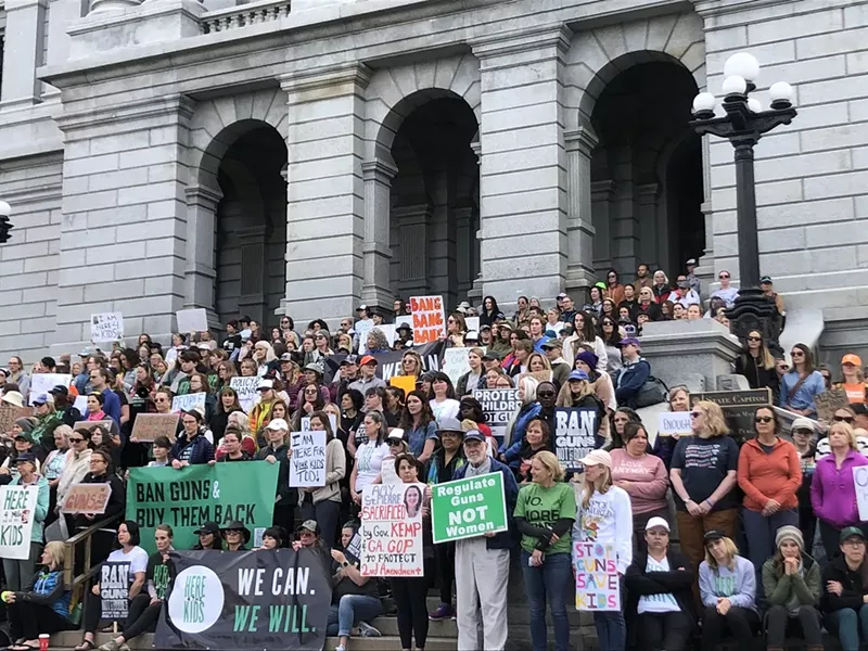 Image: Here4TheKids protesters stand on the steps of Colorado State Capitol on June 5.
