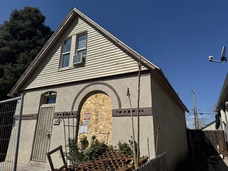 Image: boarded up vacant home in denver