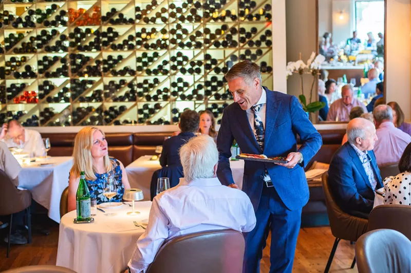 Image: man pouring wine