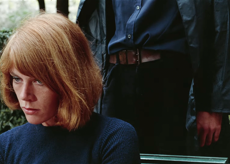 Image: woman with a man standing behind him