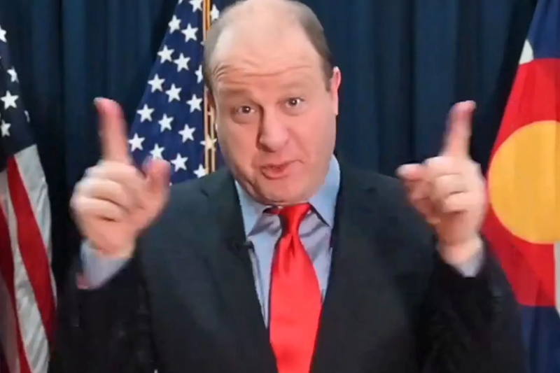 Image: man in suit gesturing