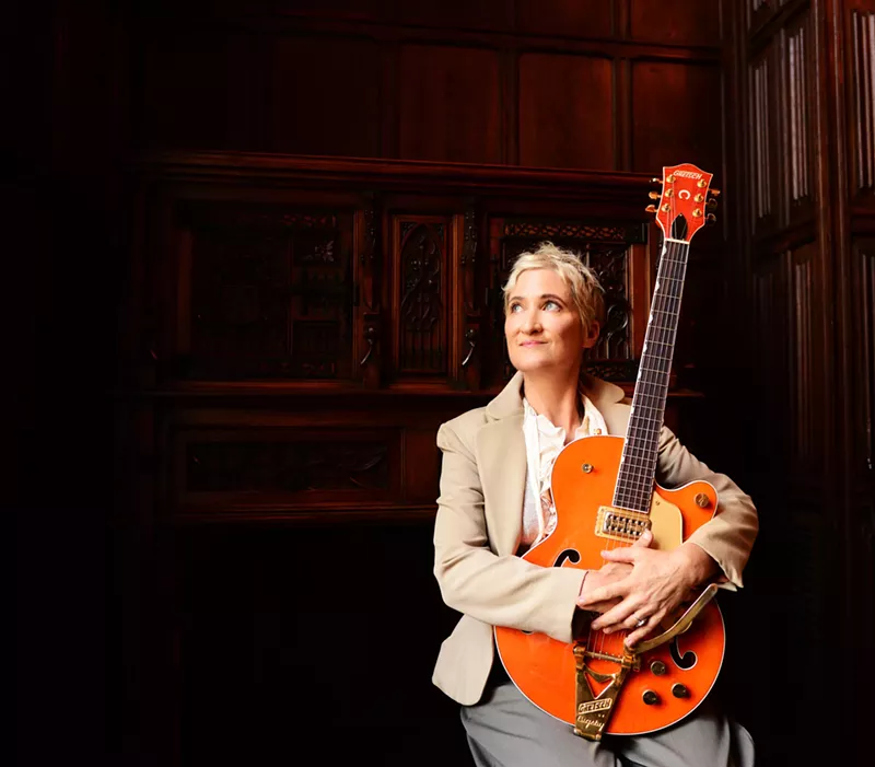 Image: denver musician jill sobule holding a guitar