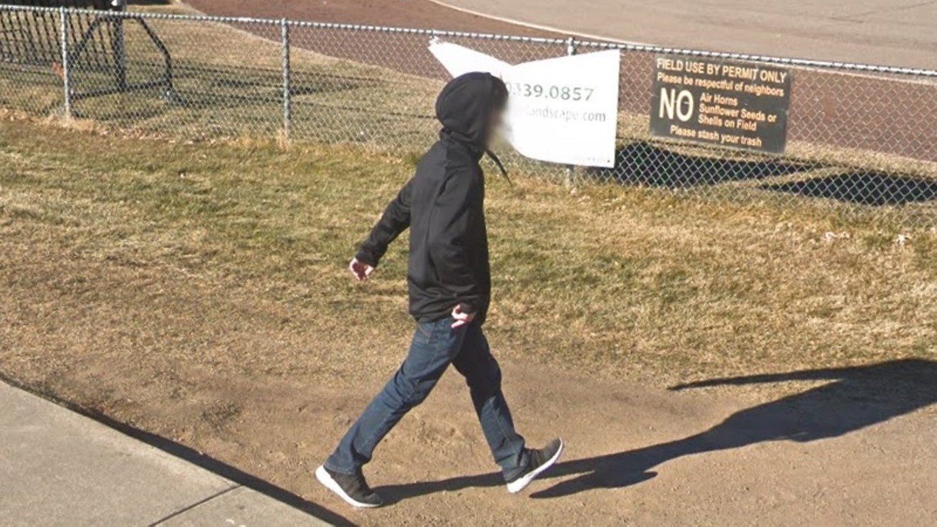 A student on the grounds of Lakewood High School, where seventeen attendees have confirmed COVID-19 infections.