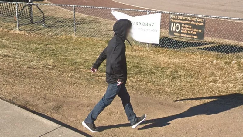 Image: A student on the grounds of Lakewood High School, where seventeen attendees have confirmed COVID-19 infections.