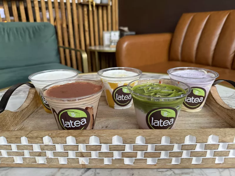Image: four boba drinks in plastic cups