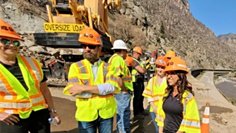 Image: U.S. Representative Lauren Boebert, right, with a work crew in Glenwood Canyon on August 11.