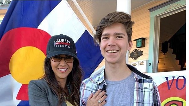 Colorado Representative Lauren Boebert standing with her eldest son Tyler.