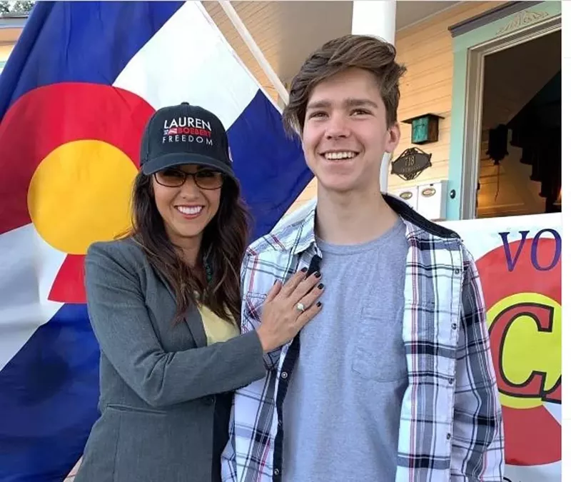 Image: Colorado Representative Lauren Boebert standing with her eldest son Tyler.