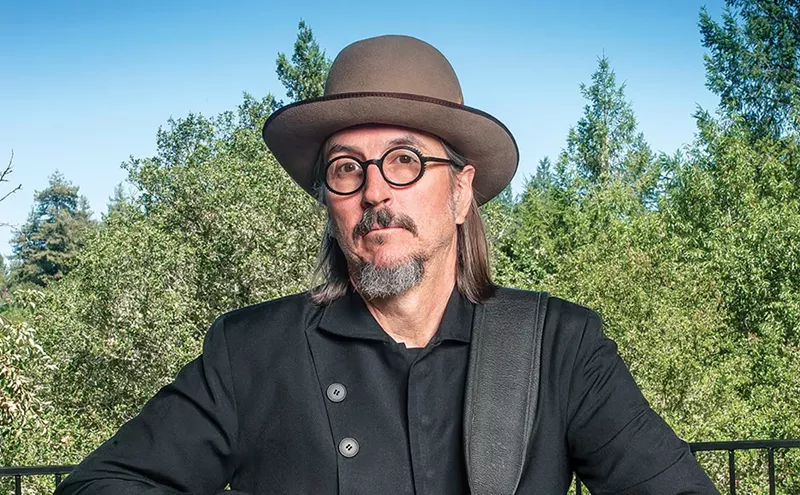 Image: man wearing a hat, glasses and goatee