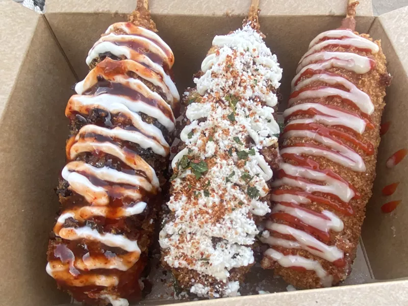 Image: The Trifecta of Korean cheese dogs: Jalapeno Poppin Cheese, Elote, and Korean Street Cheese.