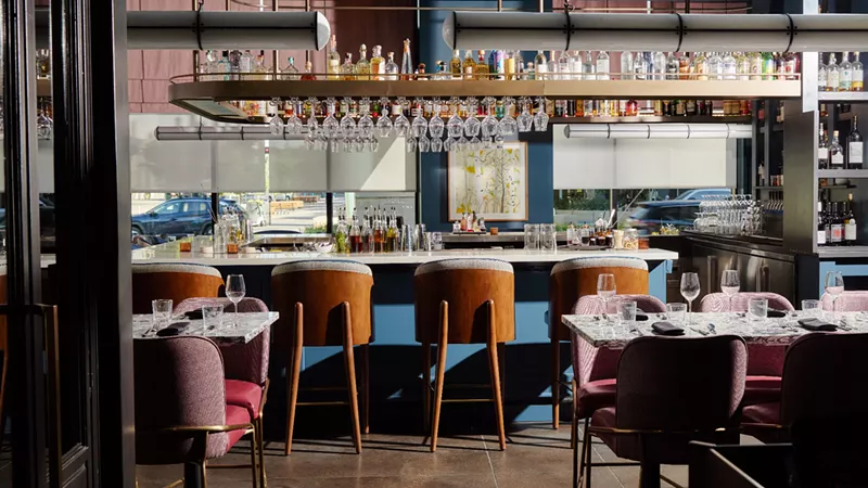 Image: empty stools at a bar