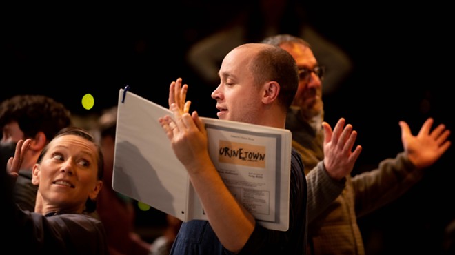 actor rehearsing with script in hand