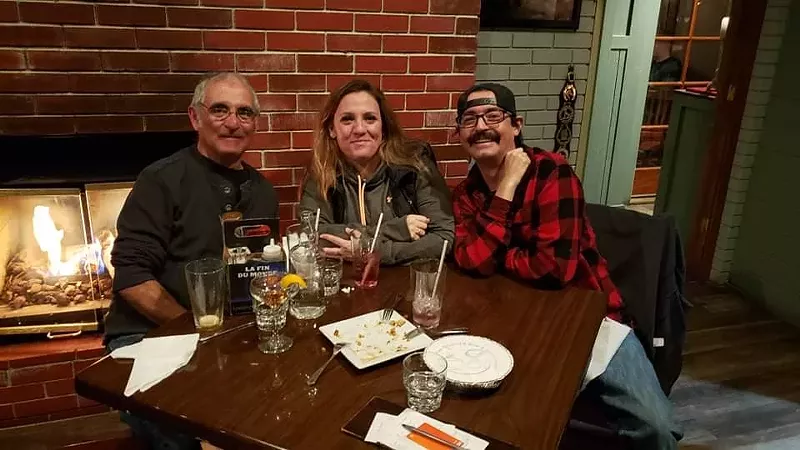 Image: Chris Schutz (right) and his family spent twenty years in their Louisville home before the Marshall Fire hit December 30.