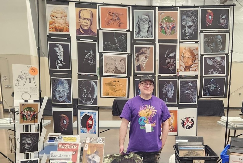 Denver artist Joe Rollman reps his pop-culture artistic wares at a local comic-con.