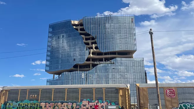 One River North apartment complex behind train track in Denver