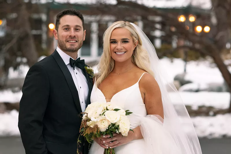 Image: Emily and Brennan pose for a wedding portrait.
