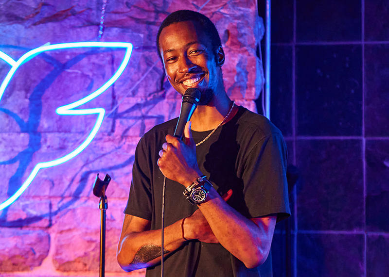 Image: Eeland Stribling performing at Comedy Works.