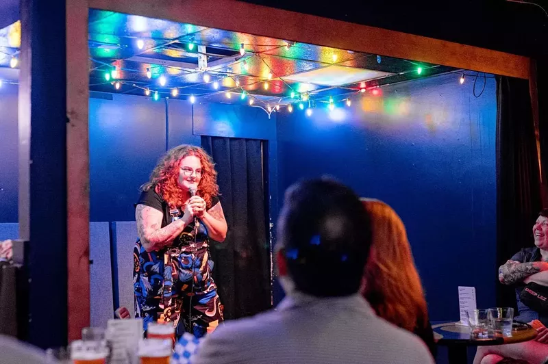 Image: redhead woman comedian on stage