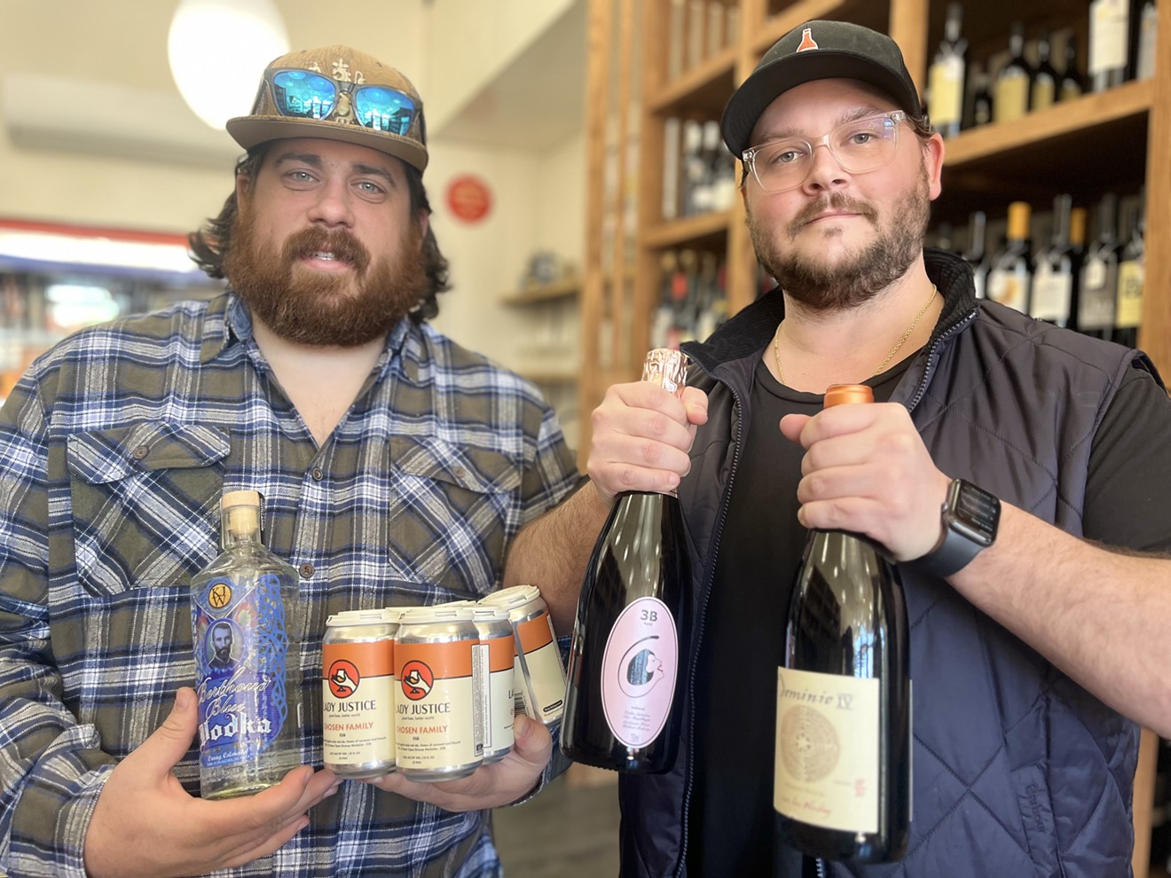 Dave (left) and Mike Levy show of some of their favorite Grog Shop booze options.