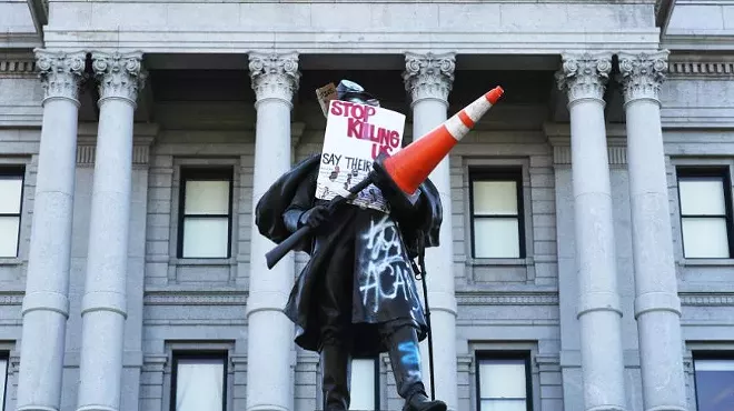 soldier statue with graffiti