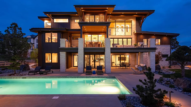 Colorado mcmansion at night with pool