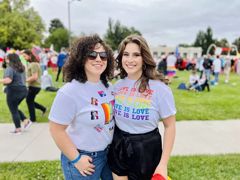 Image: two women wear pride shirts