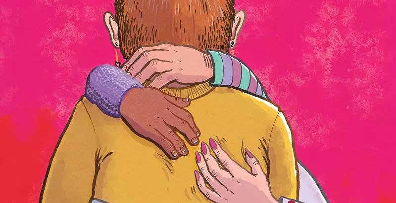 Image: back of person being hugged by many hands