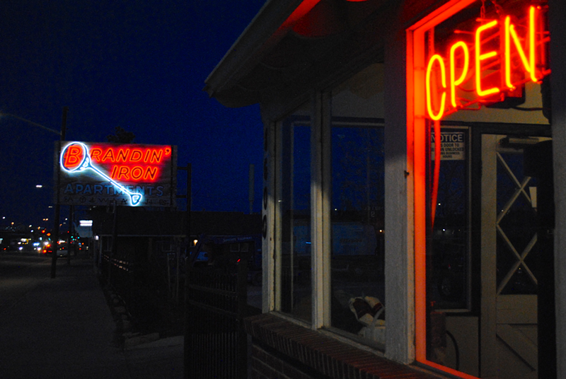 Image: Glass Arrow at the Brandin' Iron: the open sign is lit once again.