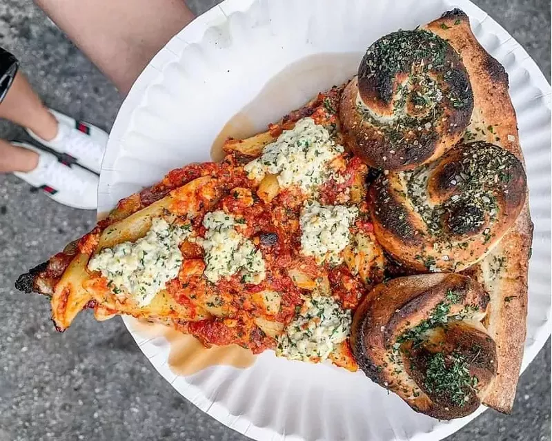 Image: Baked Ziti pizza with a garlic knots crust.