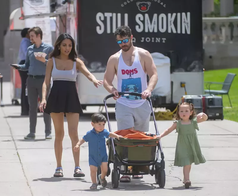 Image: Family walks in park during summer