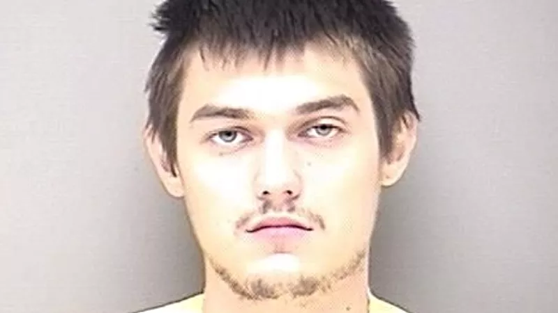 Image: The booking photo of Trevor Woodruff, nineteen.