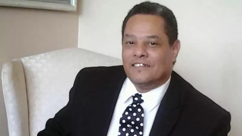 Image: A portrait of the late Pastor George Roberts.