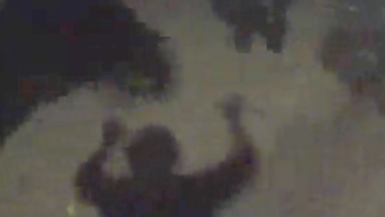A screen capture from Denver Police Department body-worn camera footage showing the instant before officers took down Michael Jacobs on July 29, 2020.