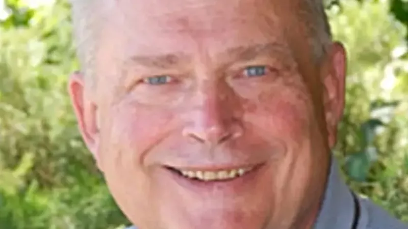 Image: A professional portrait of Dr. Paul Jones.