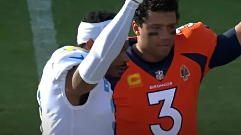 Image: The Los Angeles Chargers' Derwin James and the Denver Broncos' Russell Wilson pay tribute to recovering Buffalo Bill Damar Harmler on January 8.