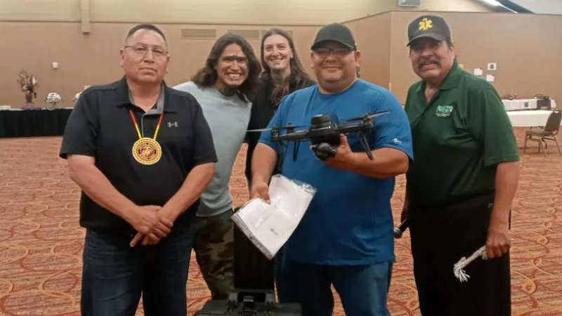 Image: (From left) Ogalala tribe president Frank D. Starr Comes Out, Look for Me's White Owl and Brandy Martinez, Pine Ridge EMS's Steve Wilson and Warrior EMS director Harold Tiger pose with one of the drones that will be used in searches for missing and murdered indigenous women.