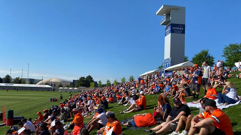 Image: The spectator hill at Broncos training camp had a lot more elbow room than last year.