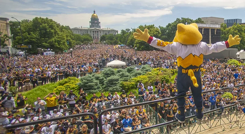 Image: mascot greets crowd