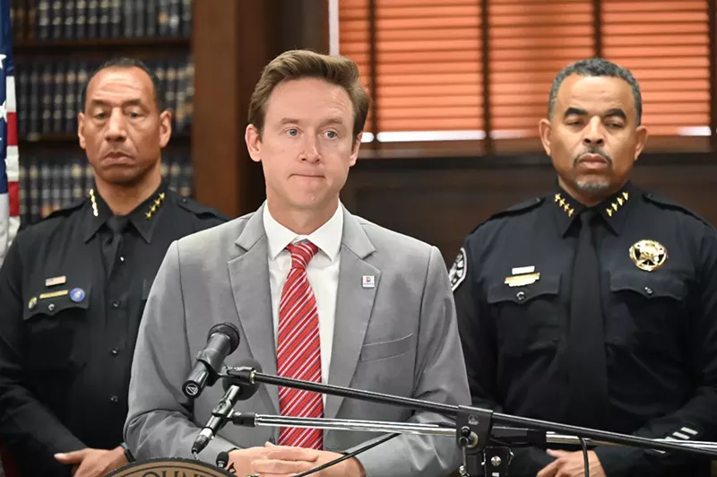 Image: Denver Mayor Mike Johnston speaks to the press.