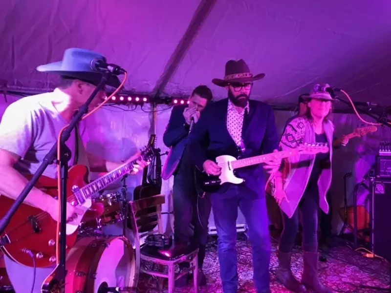 Image: musicians playing on stage