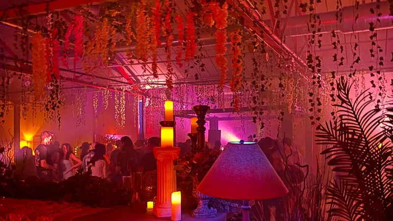 Image: view of a dance floor with hanging plants