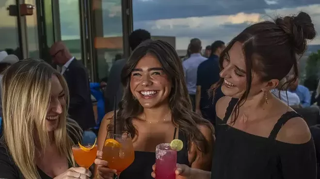 three women on rooftop deck