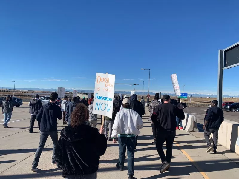Image: Colorado rideshare drivers gathered November 26 to protest at Denver International Airport.