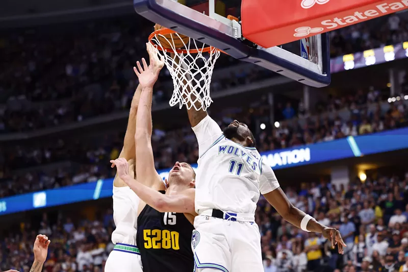 Image: Nikola Jokic attempts a shot against Naz Reid and Minnesota Timberwolves defender