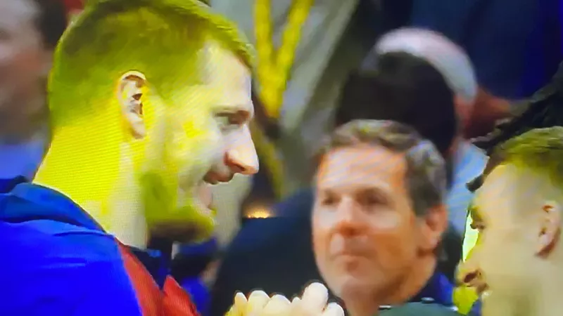 Image: Nikola Jokić cracked a smile while talking with Serbian national teammate Bogdan Bogdanovich after the Denver Nuggets' game 7 victory.