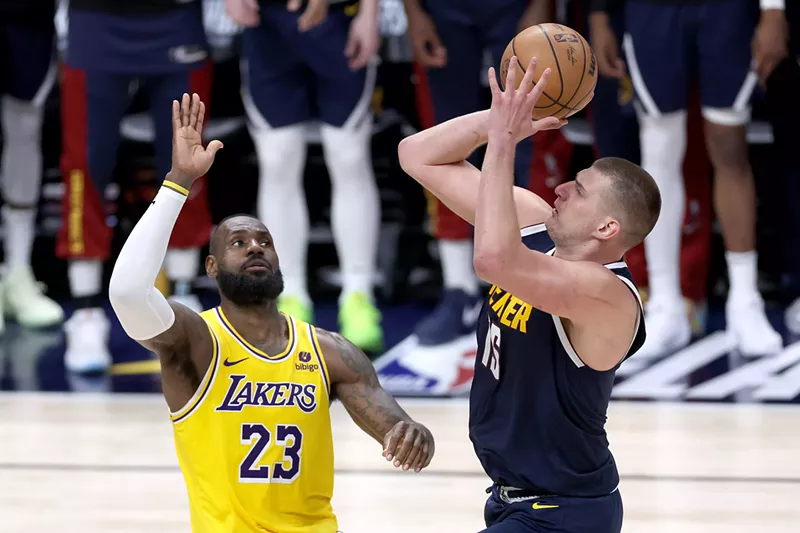 Image: Nikola Jokic shoots over LeBron James