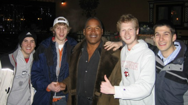 O.J. Simpson posing with fans.