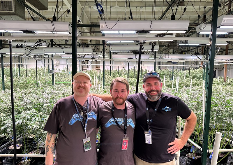 Meraki Exquisite Cannabis frontmen Jeffrey Froman (left), Phil Halpern and Matt DenBleyker pose in front of their Lafayette garden.