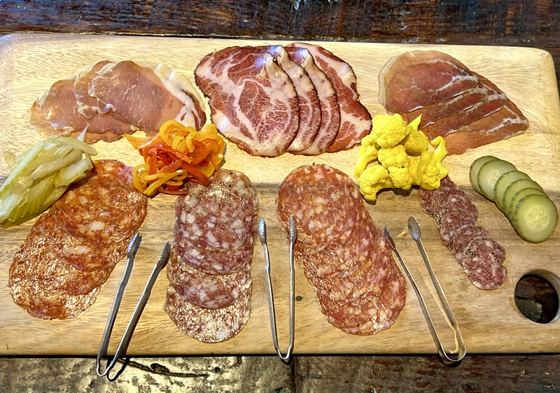 A selection of Il Porcellino salumi and whole muscle cuts.