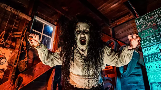man in horror wrestling costume with arms out